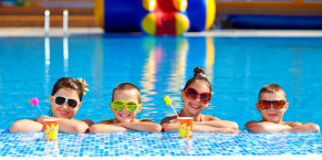 group of happy teenage kids in the pool